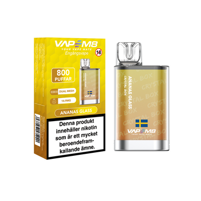 VapeM8 Crystal Box Dual Mesh Engångs Vape Ananas Glass engångsvape bredvid originalförpackning mot vit bakgrund