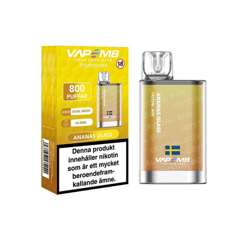 VapeM8 Crystal Box Dual Mesh Engångs Vape Ananas Glass engångsvape bredvid originalförpackning mot vit bakgrund