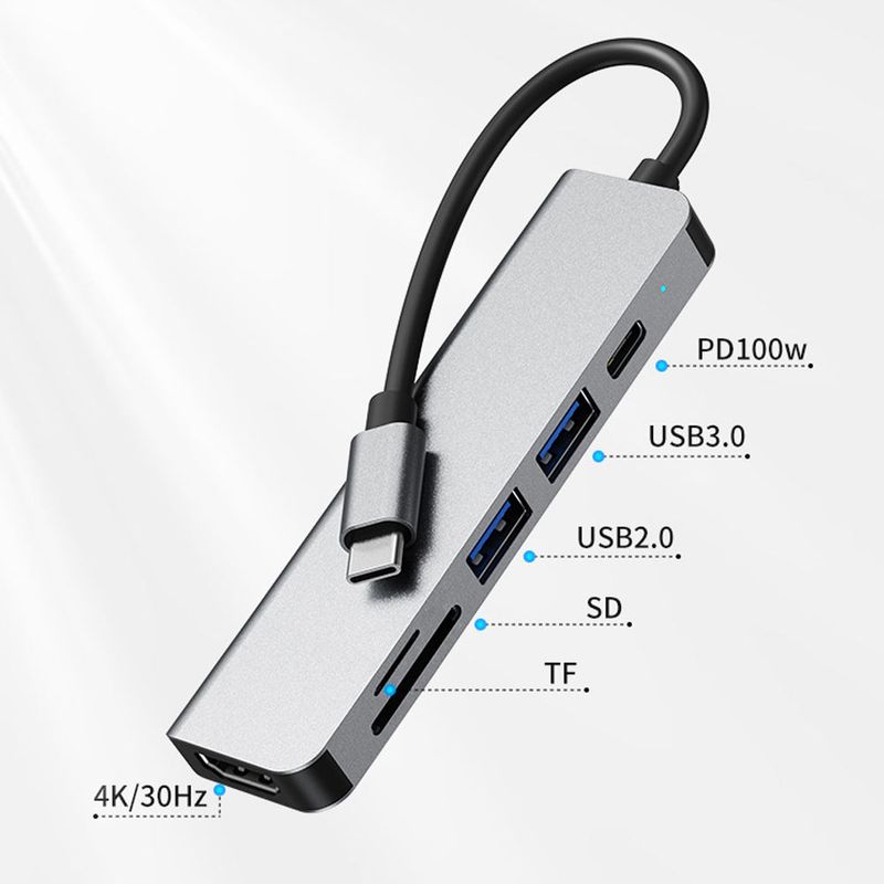 Närbild på en 6-i-1 USB-C adapter med HDMI, USB 3.0, kortläsare och PD 100W.