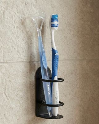 Självhäftande tandborsthållare i metall