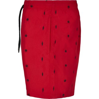 Red swim shorts with embroidered leaves