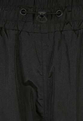 Black shimmering long pants and pirate pants lady