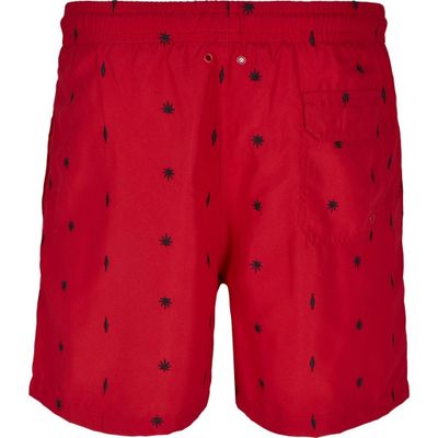 Red swim shorts with embroidered leaves