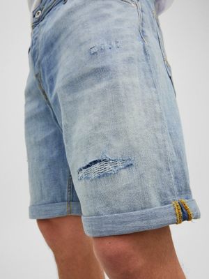 Light blue denim shorts with torns