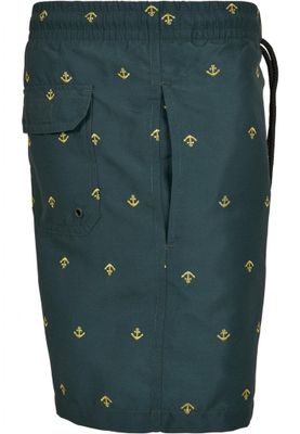 Dark green swimming shorts with golden anchors