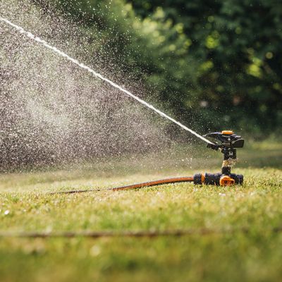 Ground spike impulse sprinkler