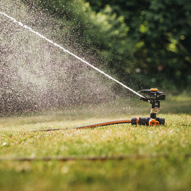Ground spike impulse sprinkler
