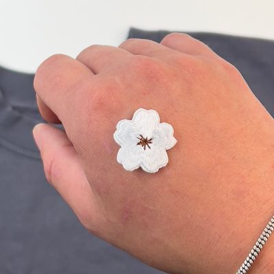 Liten blomst - Tøymerke
