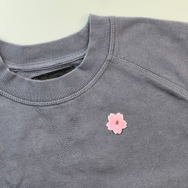 Liten blomst - Tøymerke