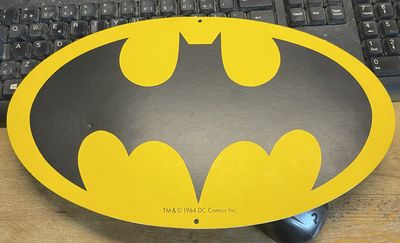 BATSIGNAL LOGO ON CARDBOARD SIGN