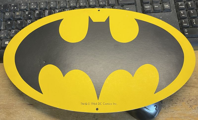 BATSIGNAL LOGO ON CARDBOARD SIGN