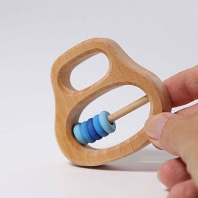 Skallra med blå ringar