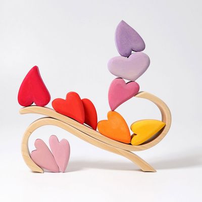Hjärta i trä med röda/rosa trähjärtan