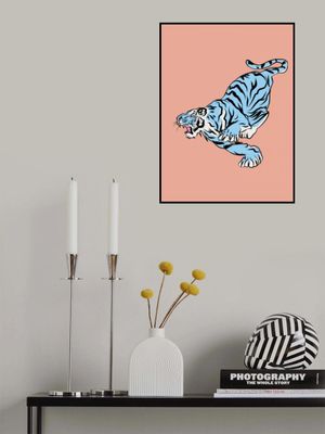 Blue Tiger Leaping Against A Soft Pink Background