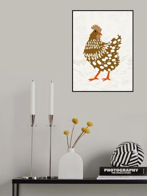 Brown hen on the grass