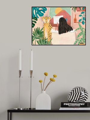 Woman taking bath in pink tropical bathroom