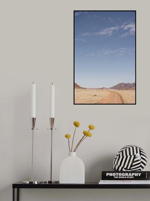 Vast Desert Road Under A Clear Blue Sky