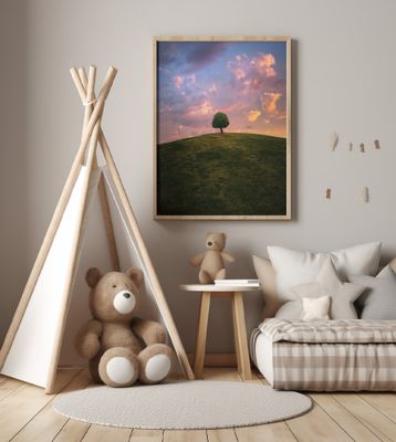 Tree on hill during sunset