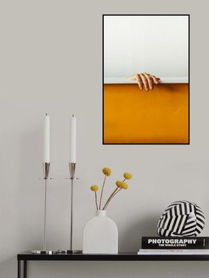 Hand Gently Gripping A White Ledge Above