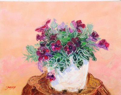 Purple Flowers In A White Vase