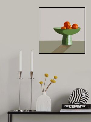 Mandarins in green bowl.