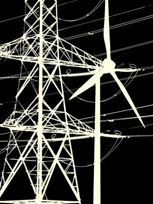 Silhouette of a Wind Turbine and Power Lines