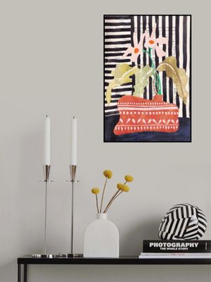 Delicate flowers in a hand-potted vase