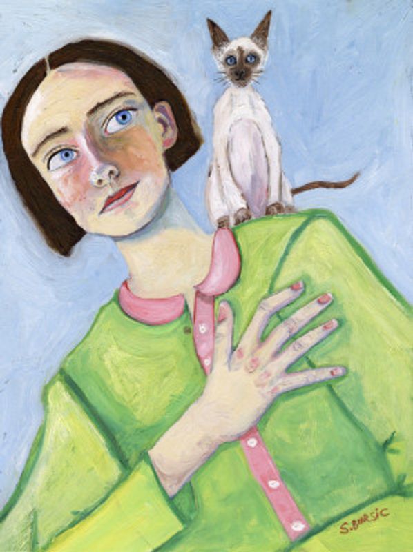 Girl with cat on shoulder