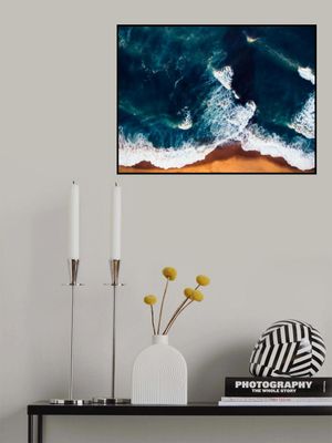 Vibrant Ocean Waves Against A Golden Sandy Beach