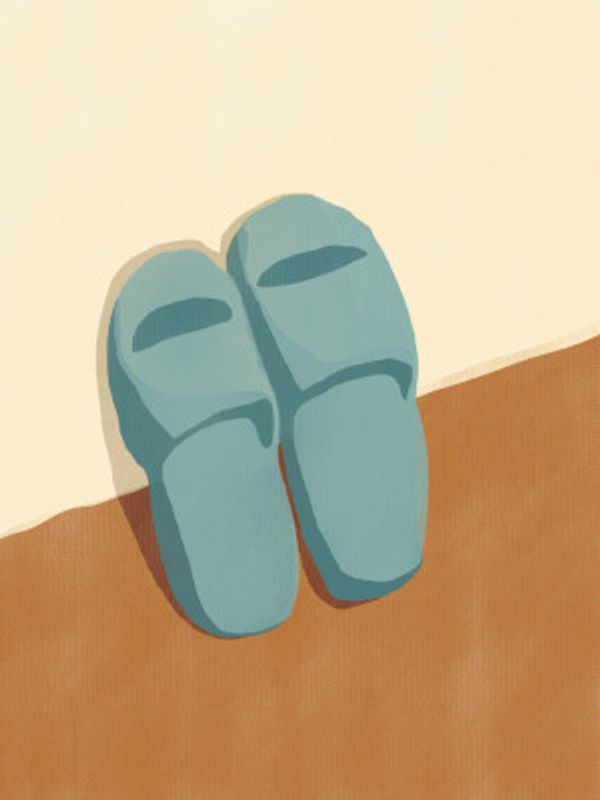 Blue Slippers On A Brown And Beige Background
