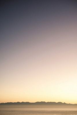 Sunset Over Distant Mountains