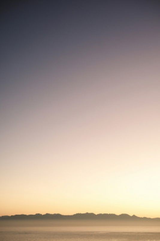 Sunset Over Distant Mountains