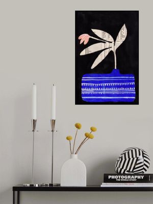 A flower in luminous blue vase