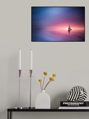 Sailing across the lake toward the sunset