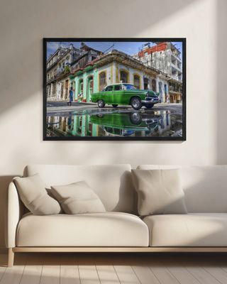 Under a worned green car. Havana.