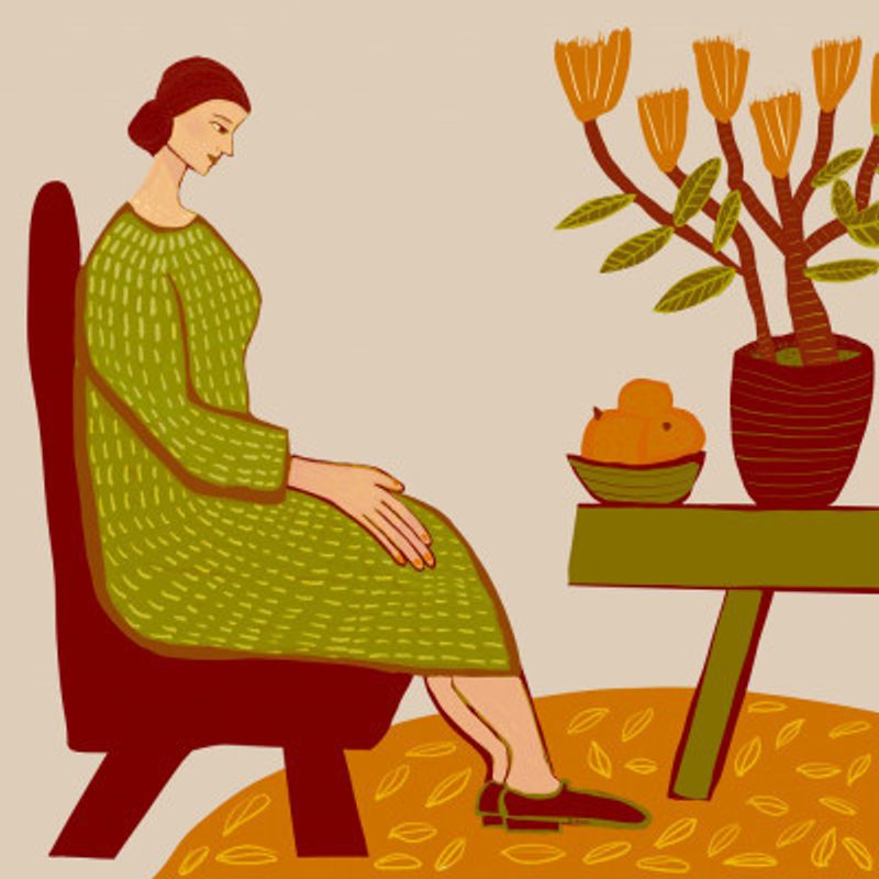 Woman sitting with pot plant