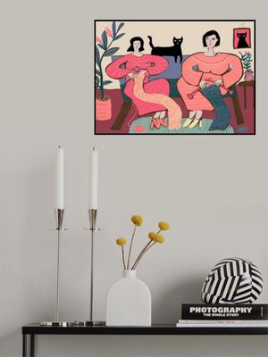 Women knitting on couch with black cat