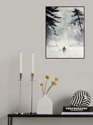 Man In a Canoe On Misty Water In a Forest Landscape