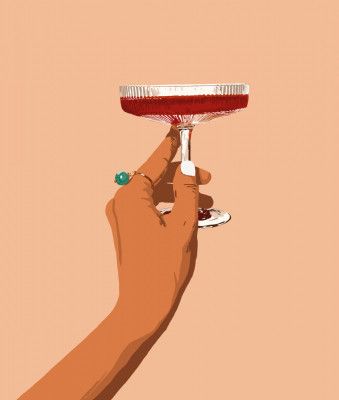 A Hand Holding A Glass Of Red Wine