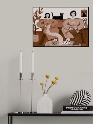 Women knitting on couch with black cat