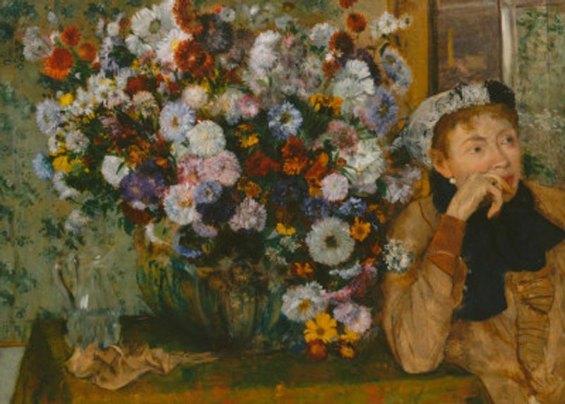 A Woman Seated Beside a Vase of Flowers