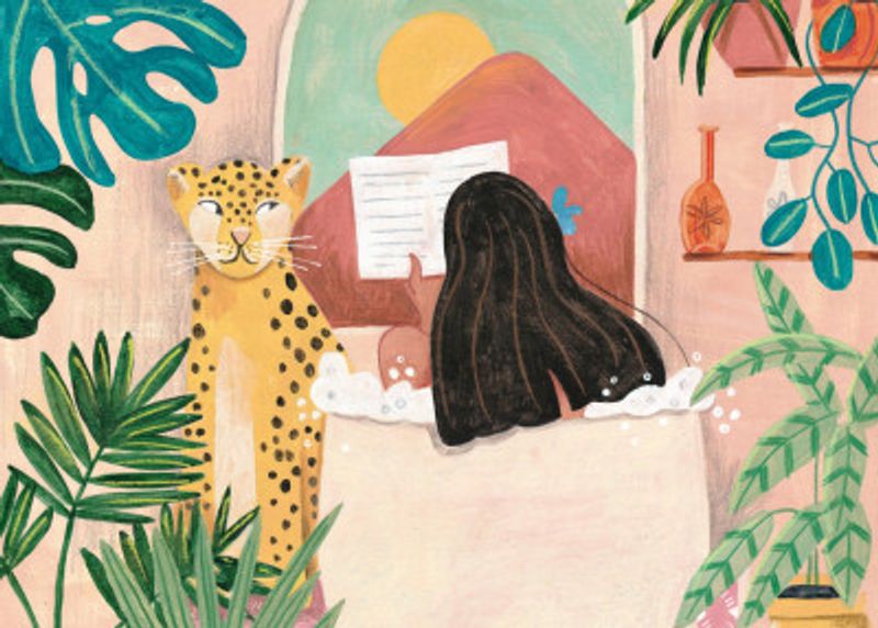 Woman taking bath in pink tropical bathroom