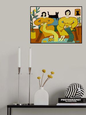 Women knitting on couch with black cat