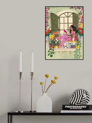 Woman reads on balcony