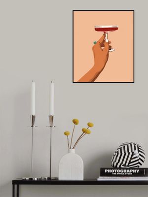 A Hand Holding A Glass Of Red Wine