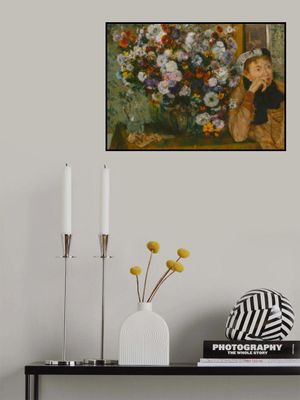 A Woman Seated Beside a Vase of Flowers