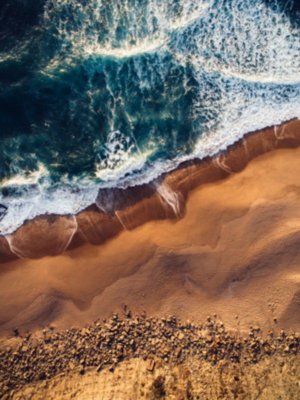 Vibrant Coastline With Turquoise Waves