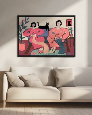 Women knitting on couch with black cat