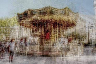 Carousel and woman in red in Avignon