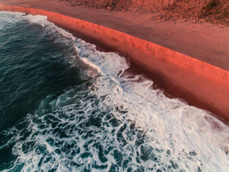 Turquoise Ocean Waves Meeting A Sunlit